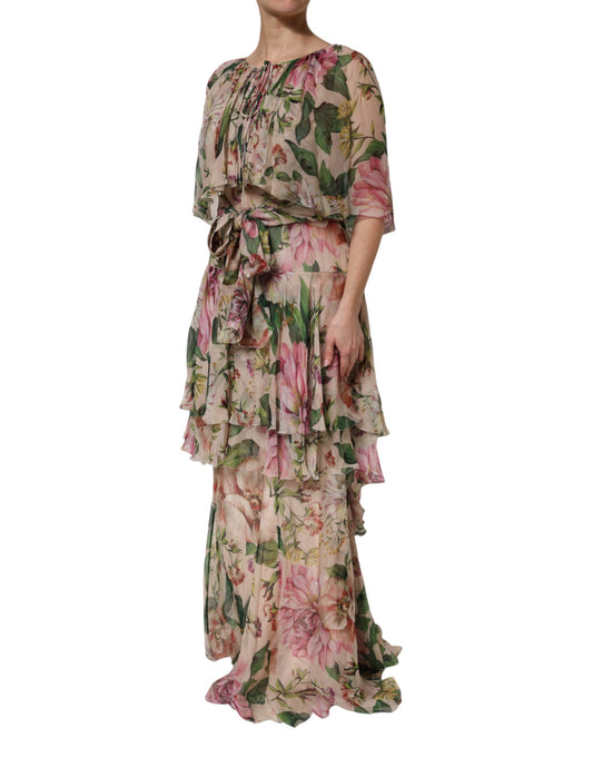 A long pink floral print dress with tiered ruffles and a V-neckline