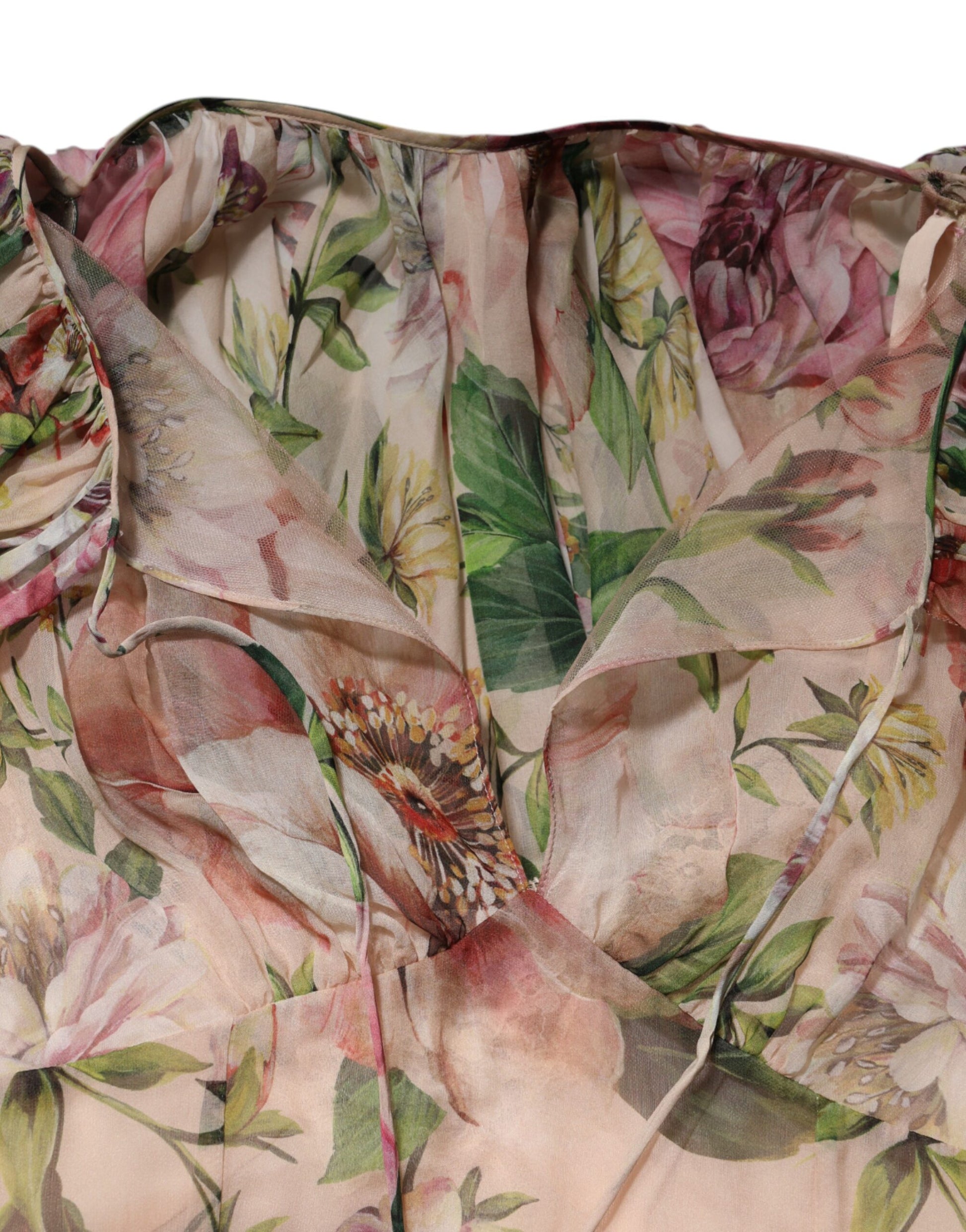 A pink floral print tiered long maxi dress with a V-neckline