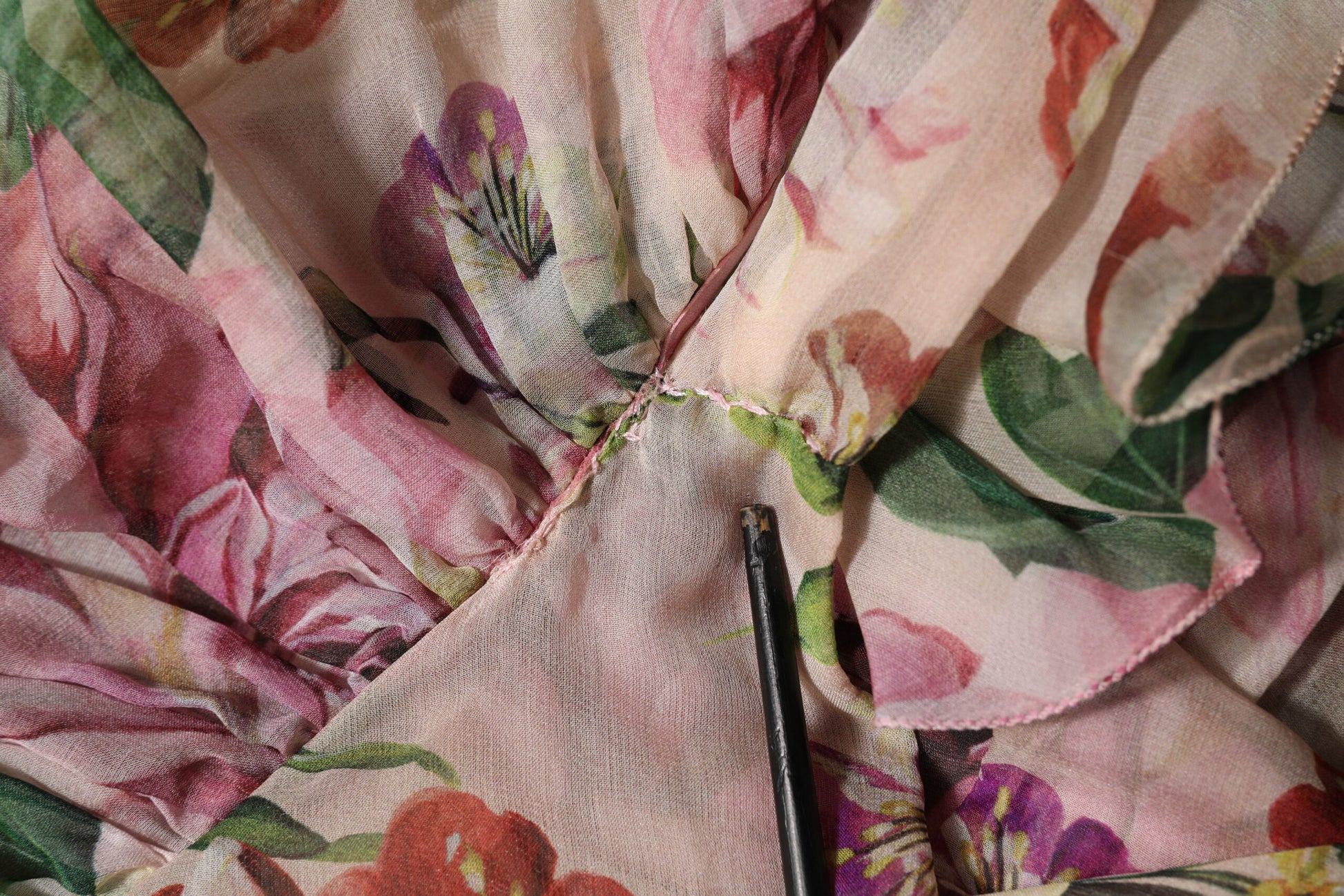 A pink floral print tiered long maxi dress by Dolce & Gabbana