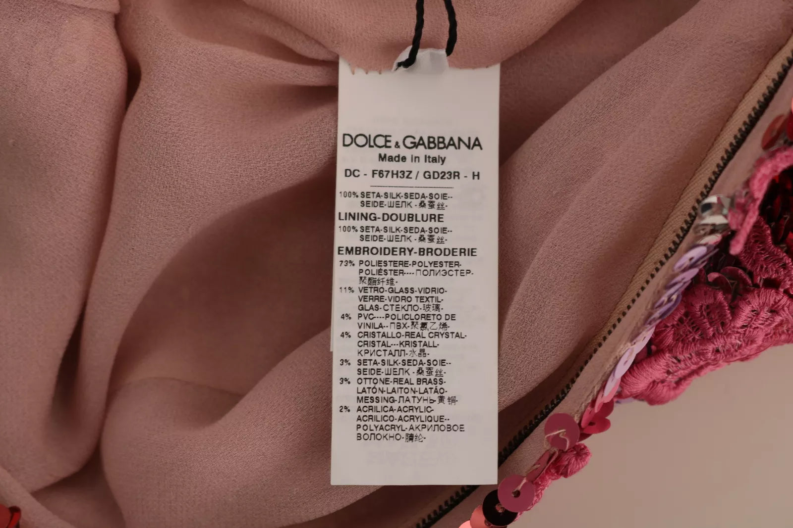A pink floral sequined crystal gown dress with a tag from Dolce & Gabbana
