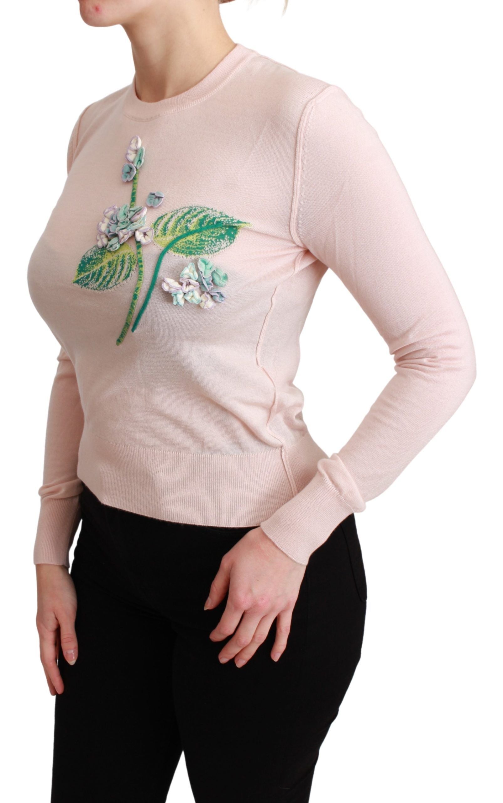 Pink sweater with floral embroidery on front
