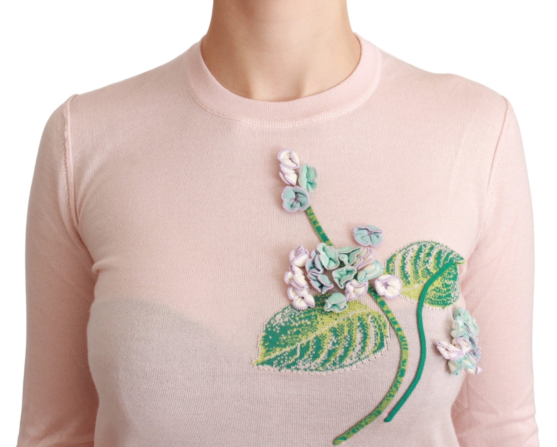 Pink sweater with floral embroidery on front