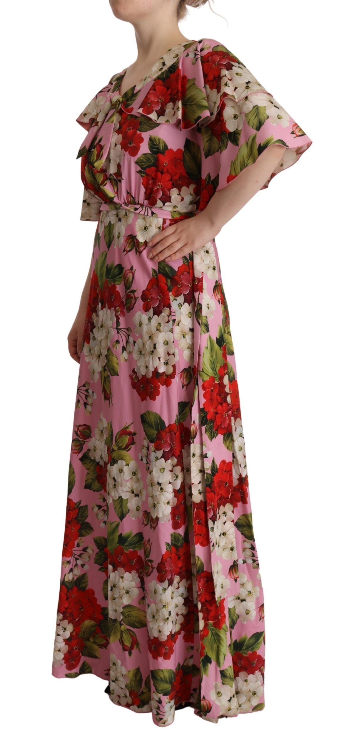 A long pink floral silk stretch gown with a high neckline and sleeves
