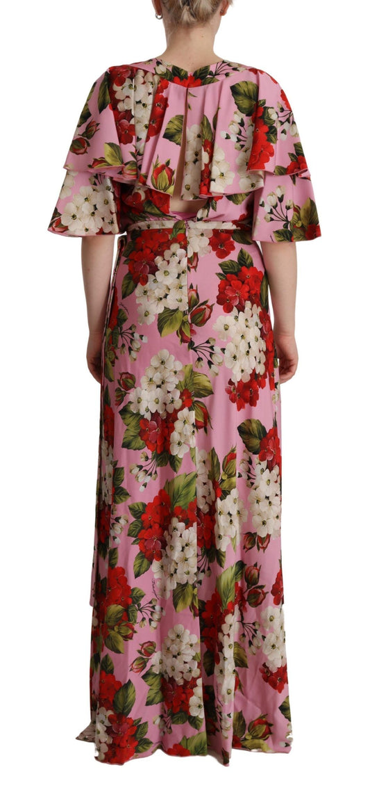 A long pink floral silk stretch gown with a V-neckline and three-quarter sleeves