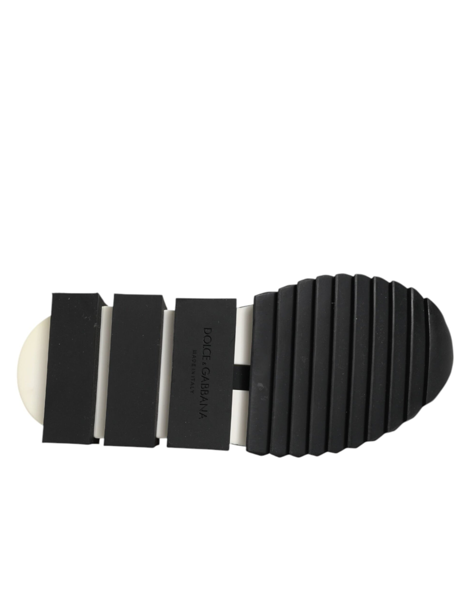 Footwear with a black sole and multiple straps for support