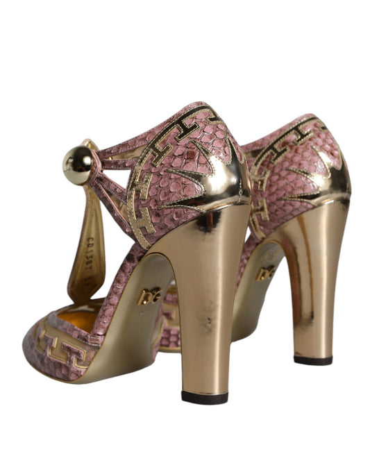 Pair of gold high heel shoes with pink accents