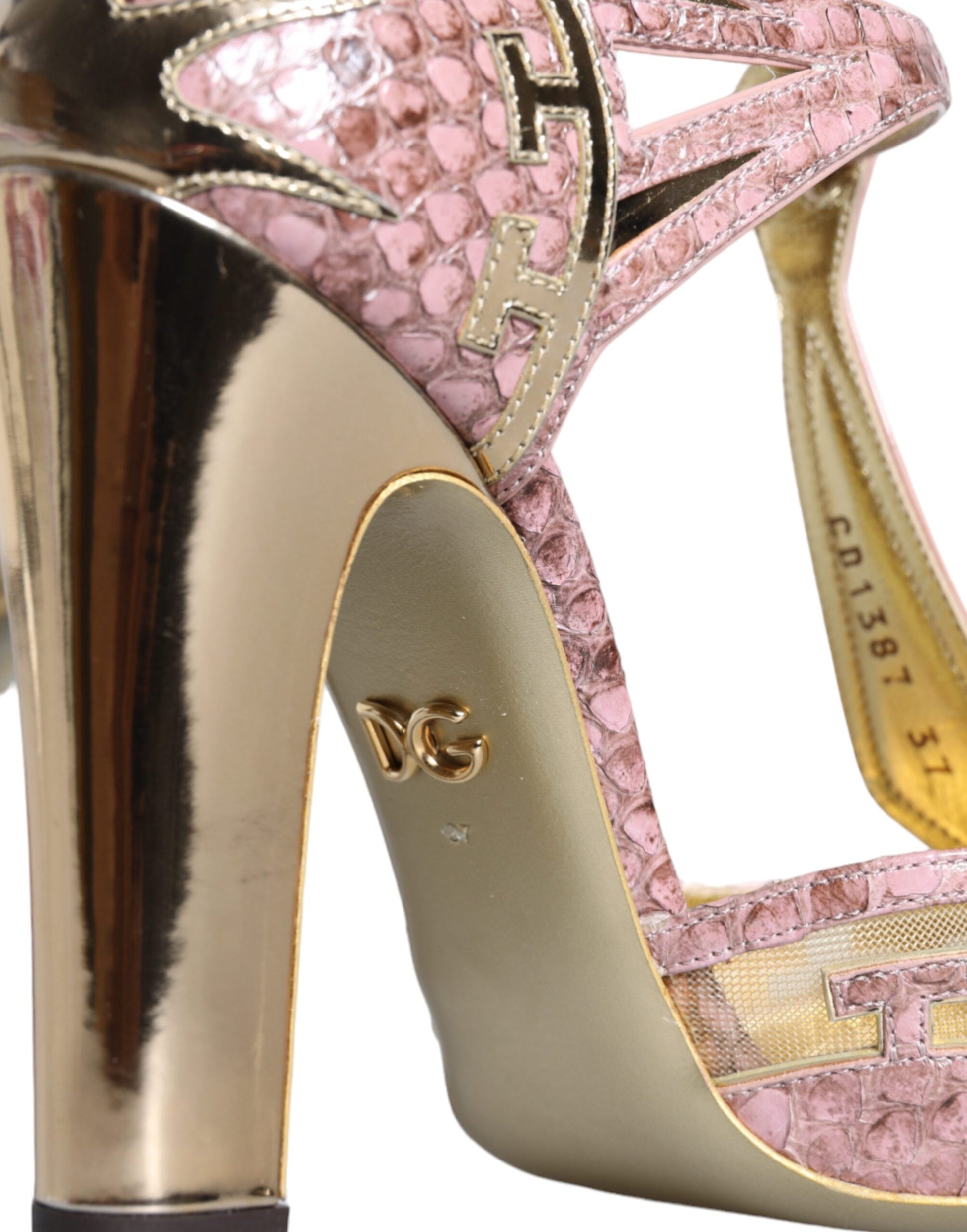High heel shoe with gold trim and pink accents