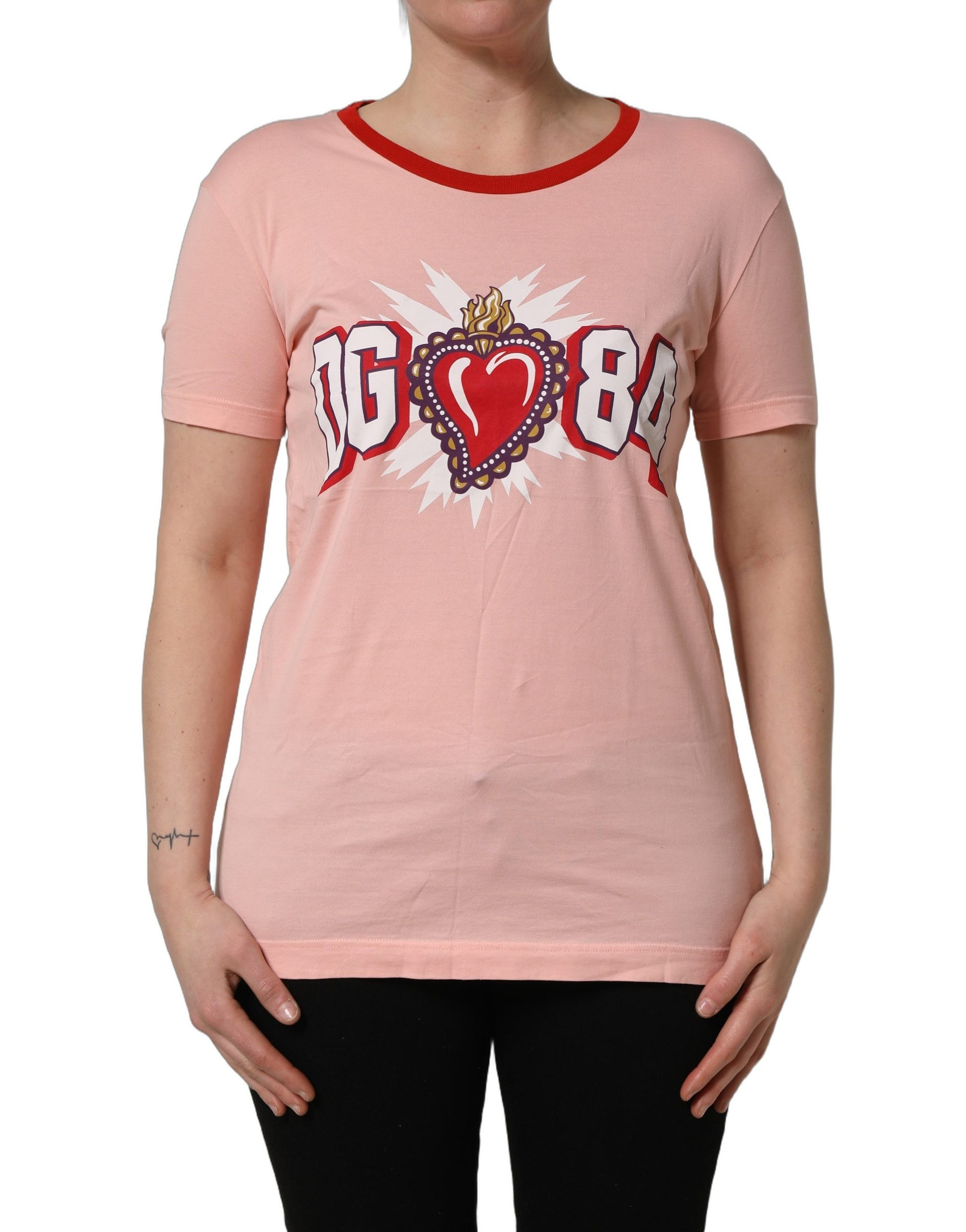 A pink graphic print cotton crew neck t-shirt with a heart design