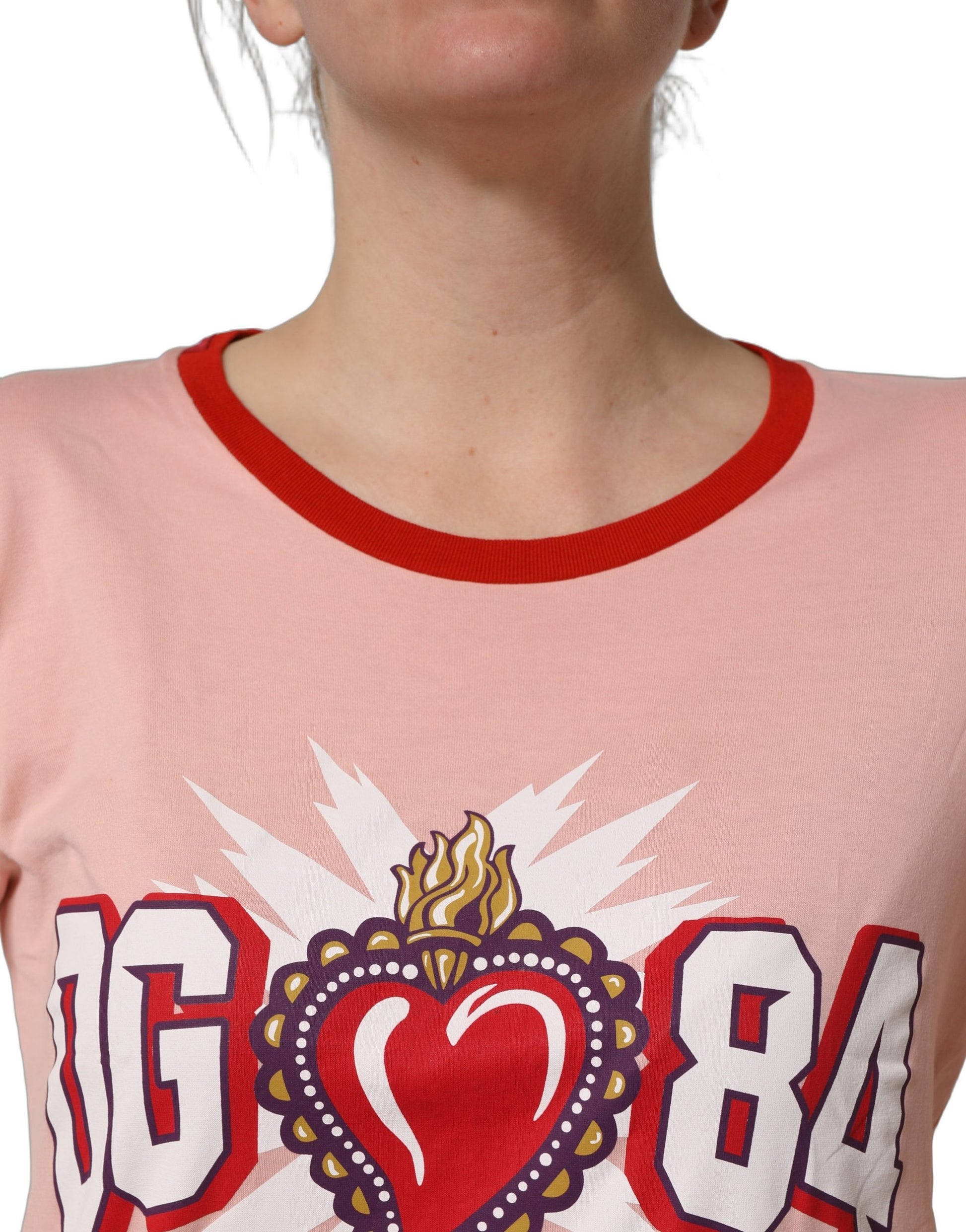 A pink graphic print crew neck t-shirt with a heart design