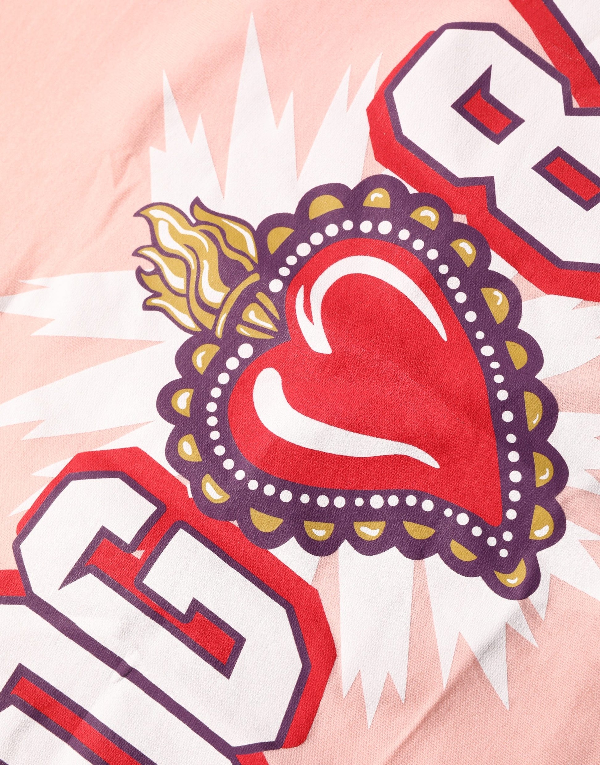 A pink graphic print crew neck t-shirt with a heart design