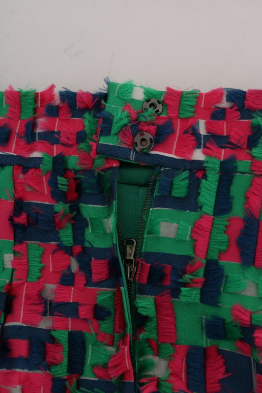 Colorful patchwork quilt with fringe detailing