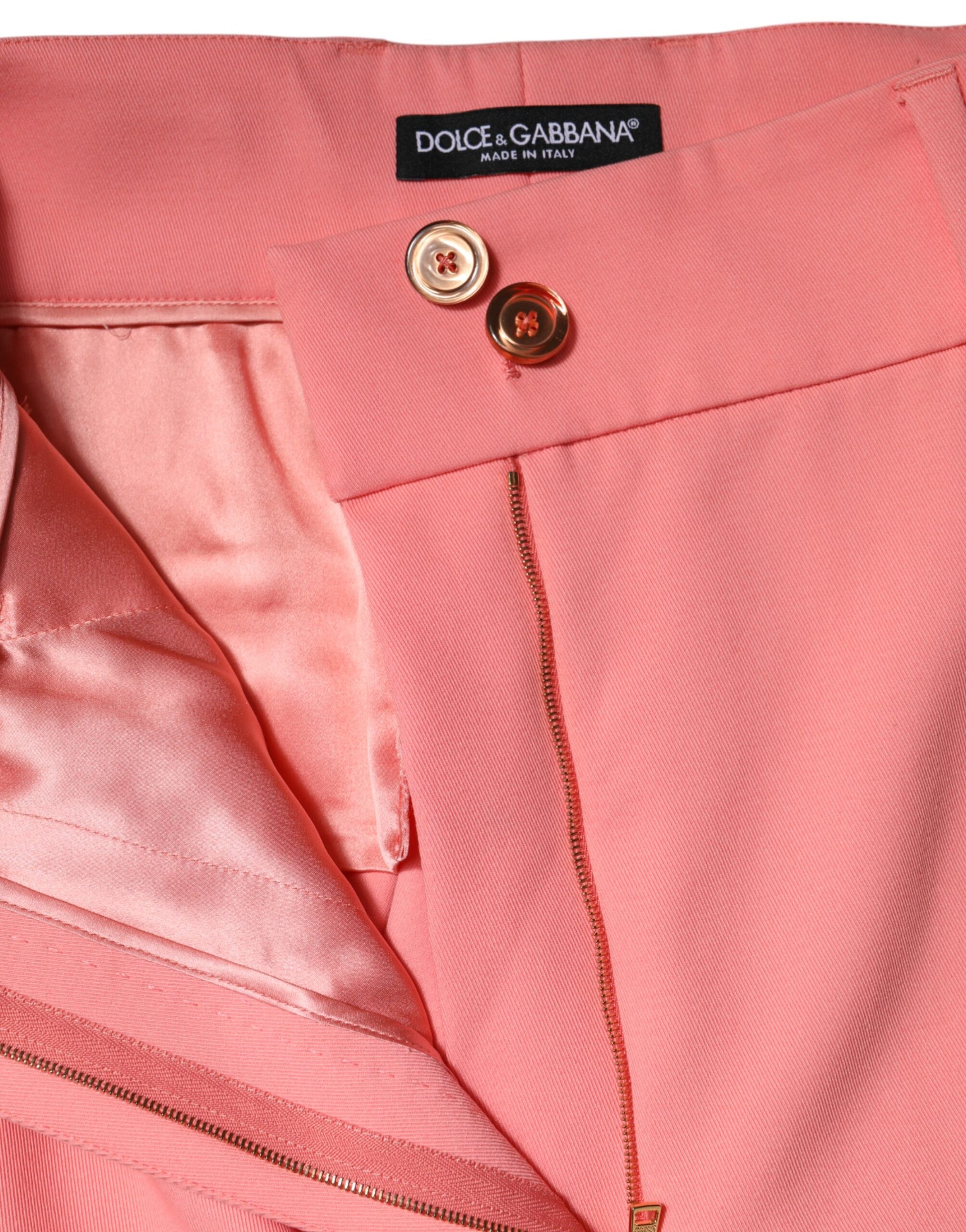 Pink high waist dress trousers with gold zipper and button detail