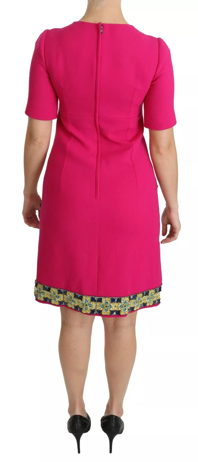 A pink dress with a floral pattern on the skirt, designed by Dolce & Gabbana