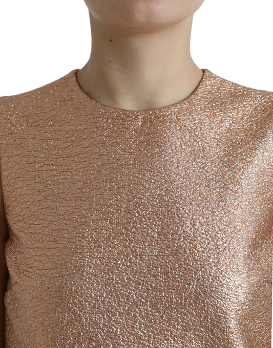 A sleeveless pink jacquard dress with a glittery texture