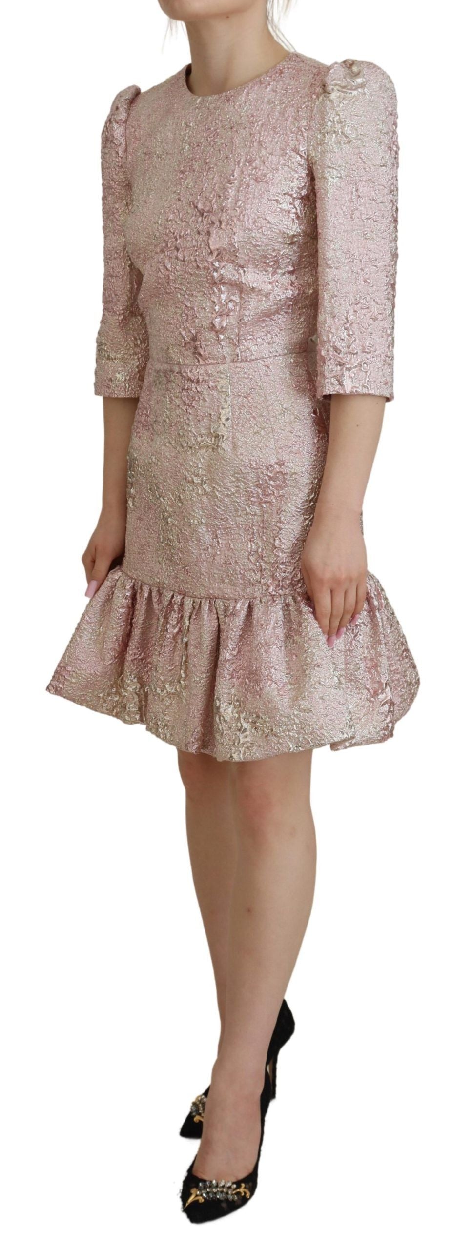 A pink sequined midi dress with a ruffled hem and sleeves