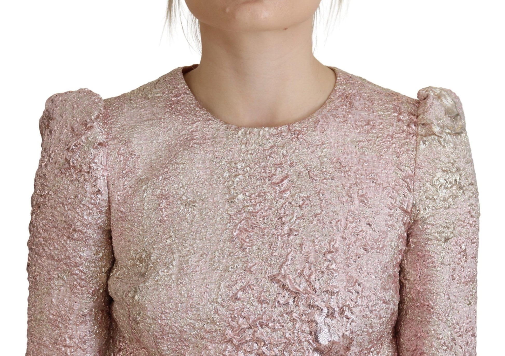 A pink glittery dress with a 3/4 sleeve and midi length