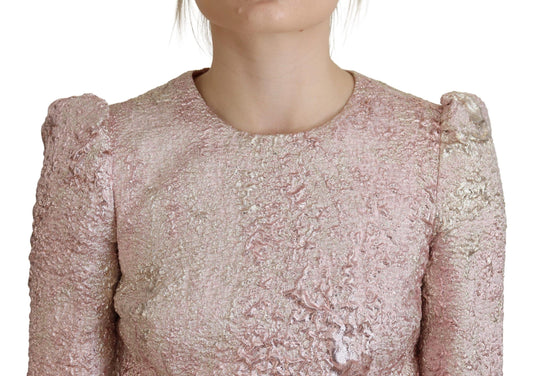 A pink glittery dress with a 3/4 sleeve and midi length