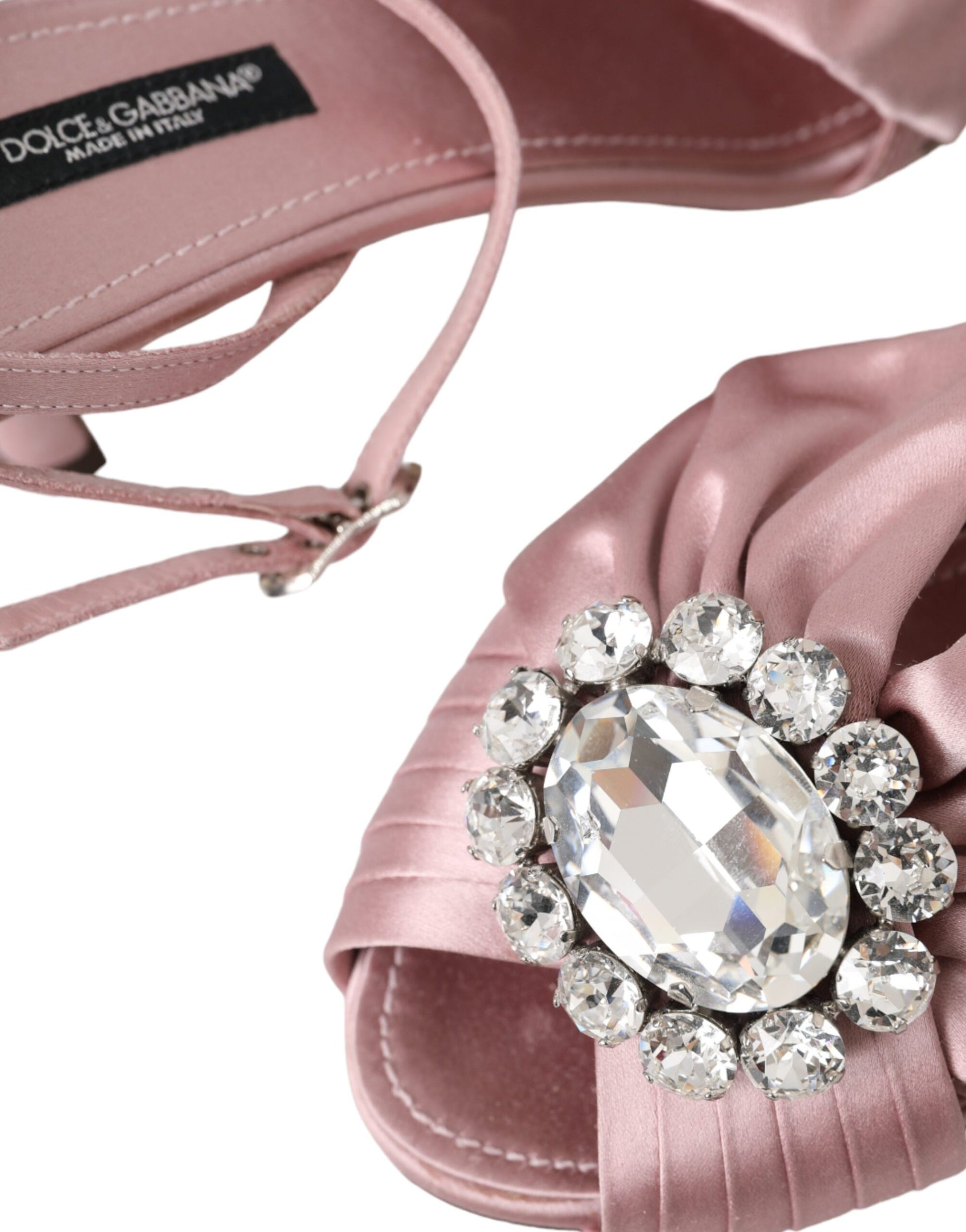 Pink satin shoe with large diamond embellishment on toe