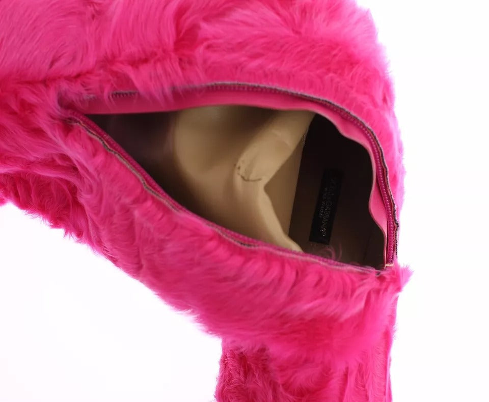 Pink fuzzy stuffed animal with open zipper revealing inner ear tag