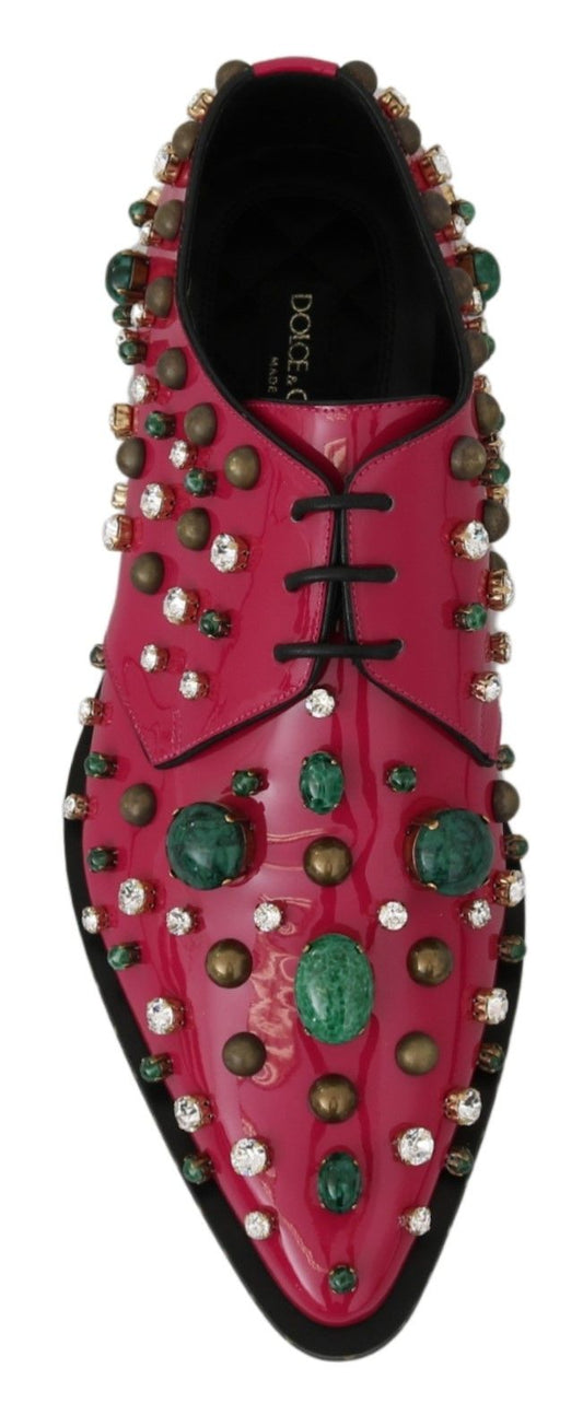 Pair of red shoes with embellishments and jewels
