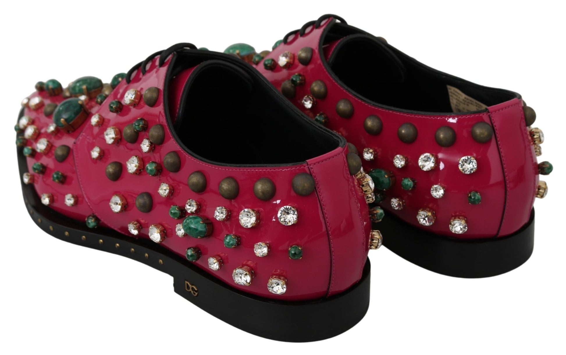 Pair of red shoes with multiple embellishments including studs and jewels