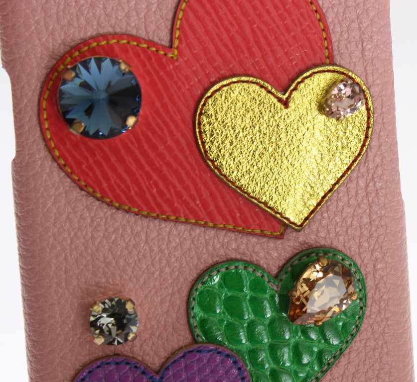 Decorative heart shaped embellishments on a pink leather surface