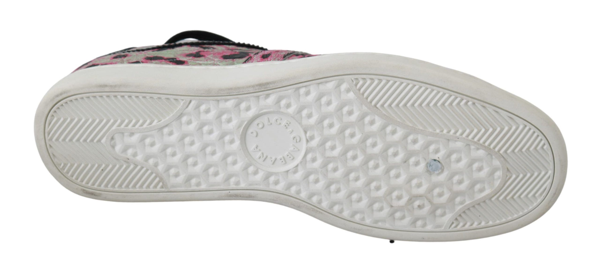 A single shoe against a neutral background. It appears to be a sneaker with a patterned upper and a white sole featuring