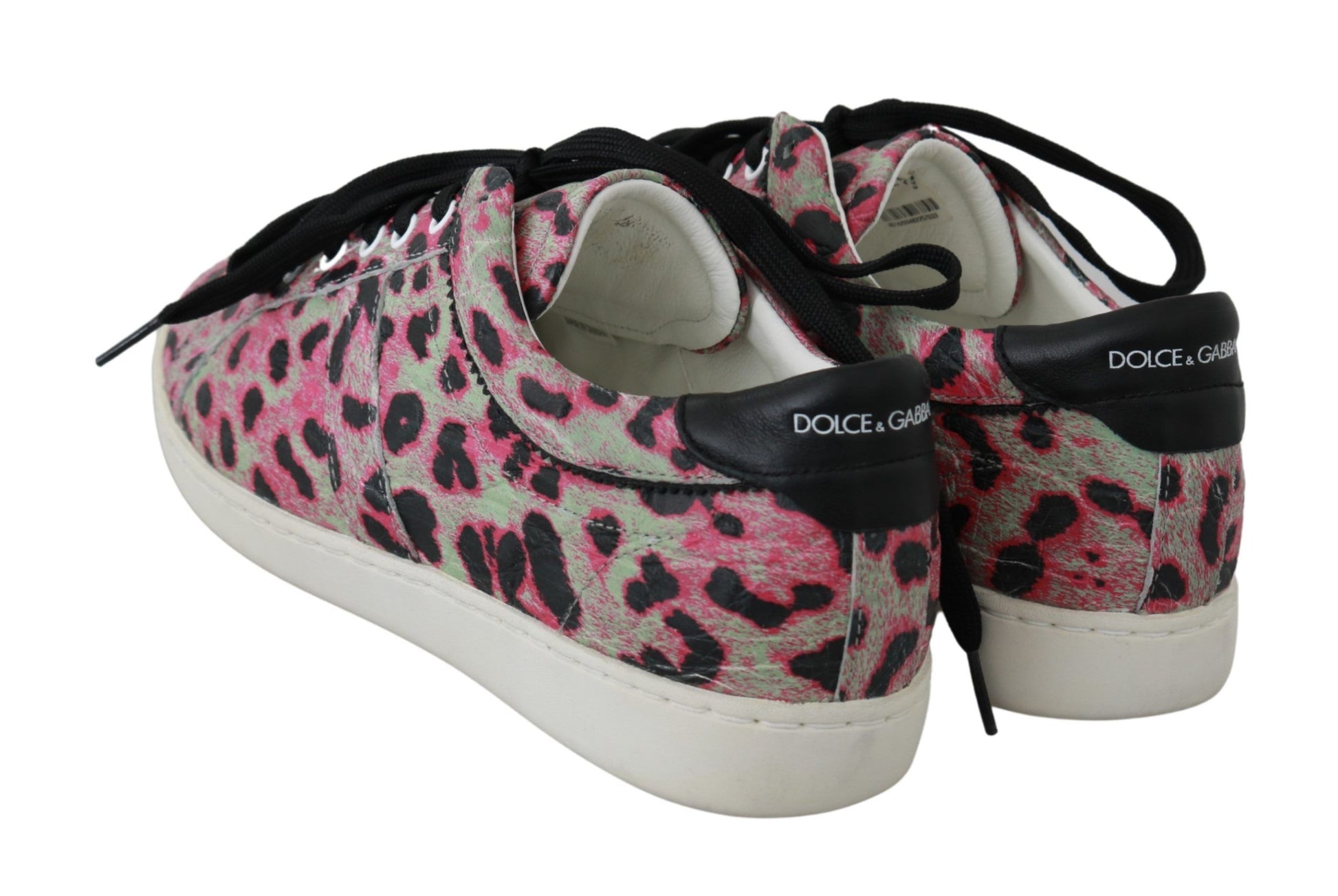 Pair of sneakers with a camouflage pattern on top and white soles