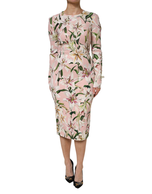 A pink midi dress with floral pattern and stretchy fabric, designed by Dolce & Gabbana