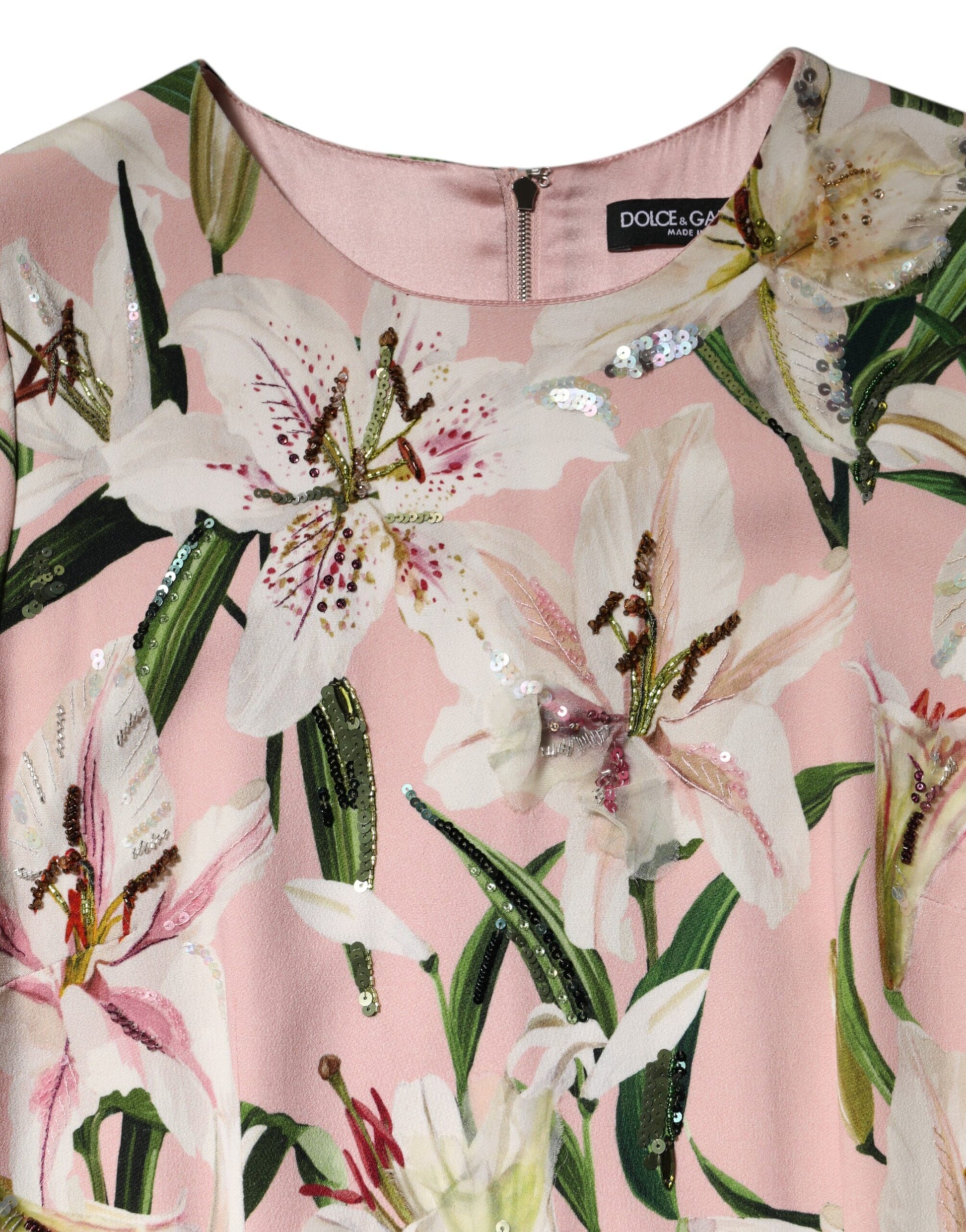 A pink midi dress with lily print and sparkles, from the brand Dolce & Gabbana