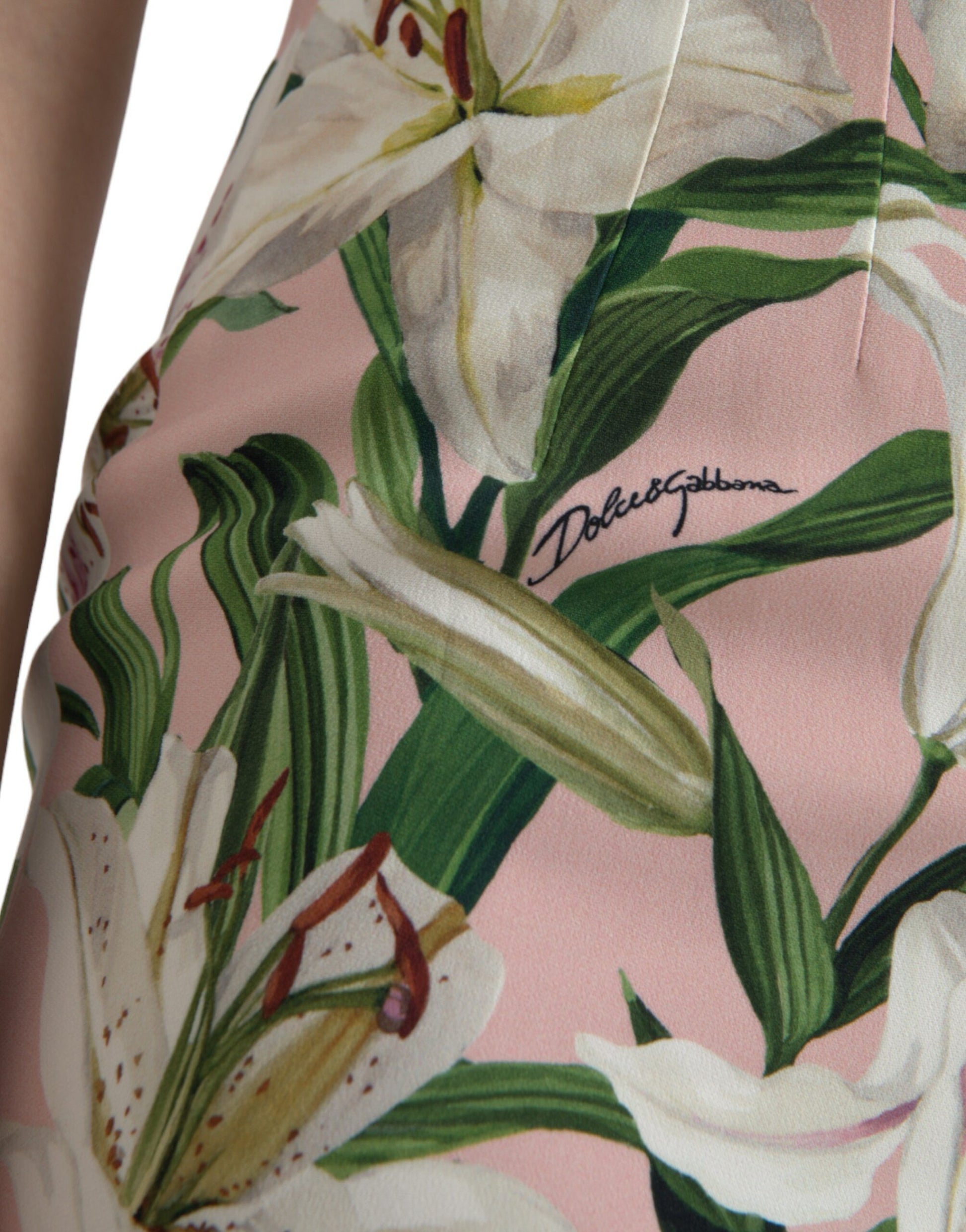 A pink floral dress with a lily print and stretchy material