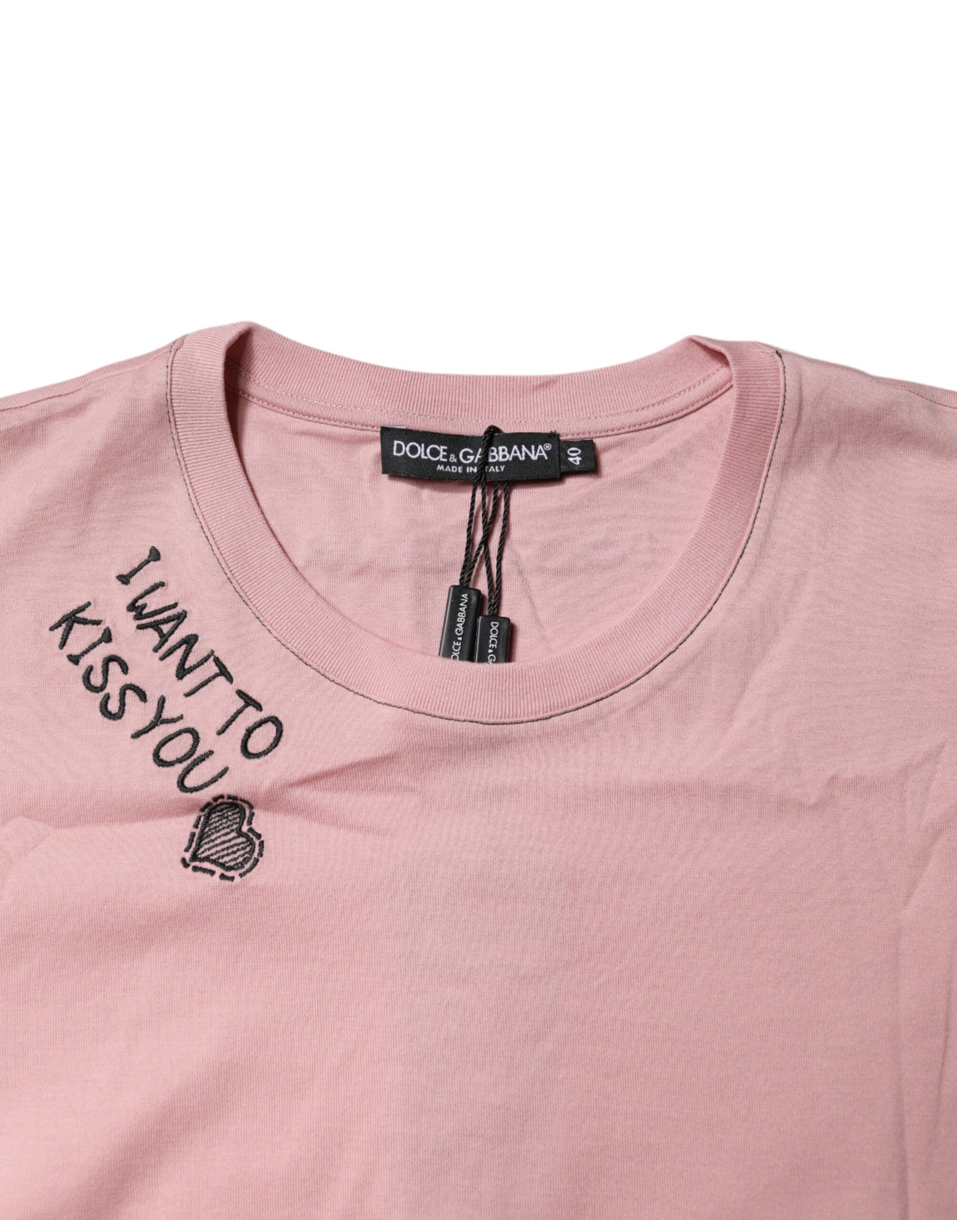 Pink t-shirt with black lettering on front