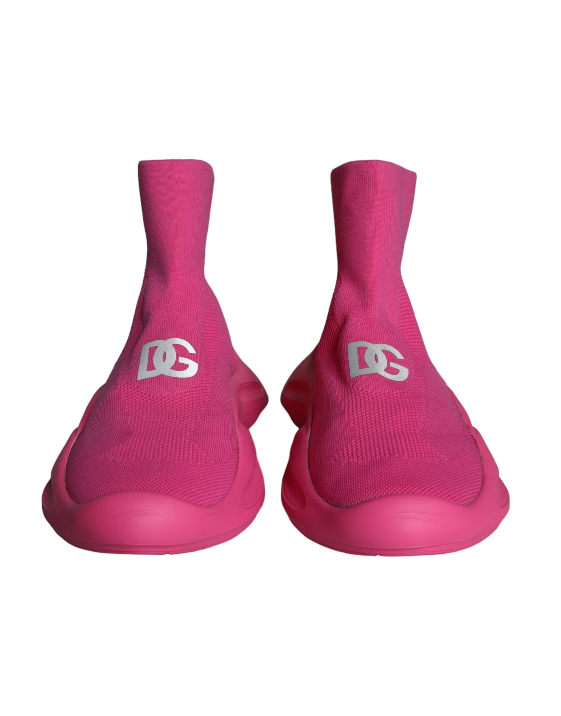 Pair of pink athletic shoes with white logo on side