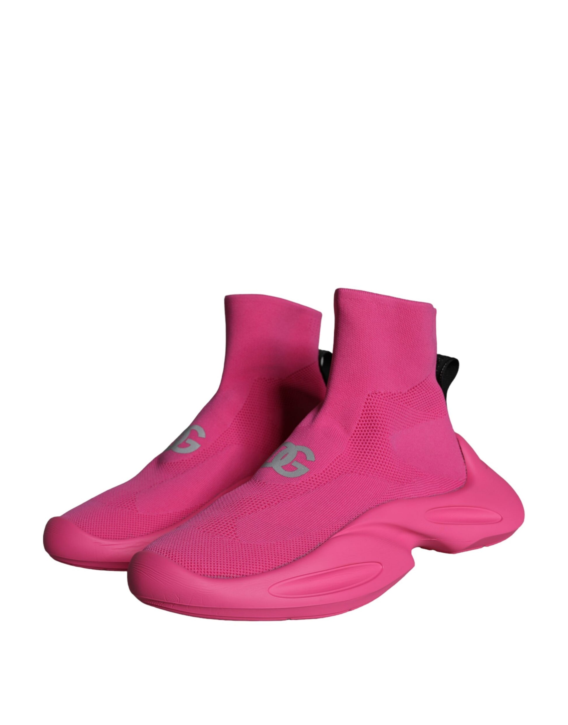 Pair of pink athletic shoes with black laces and soles