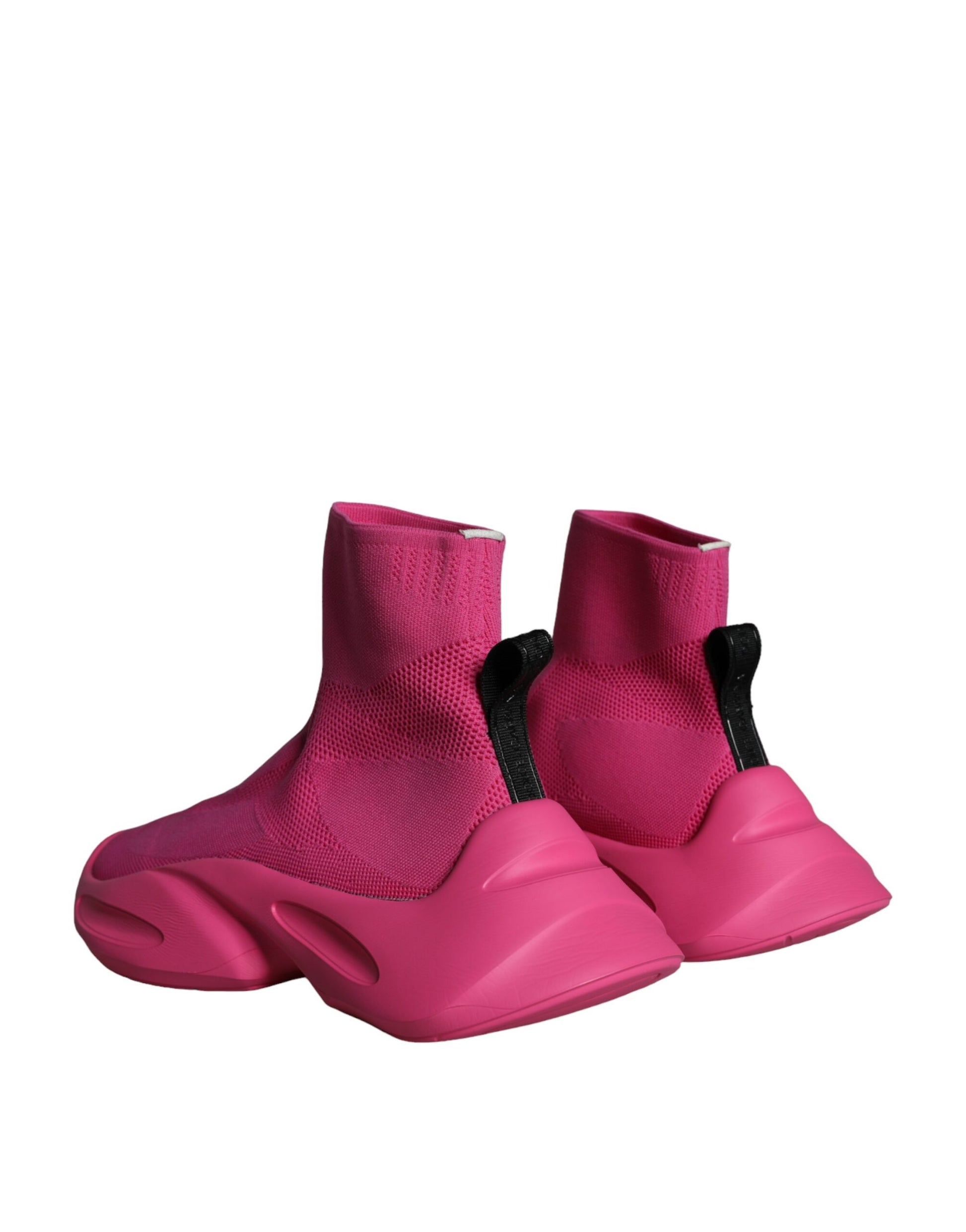Pair of pink snow boots with black straps and buckles