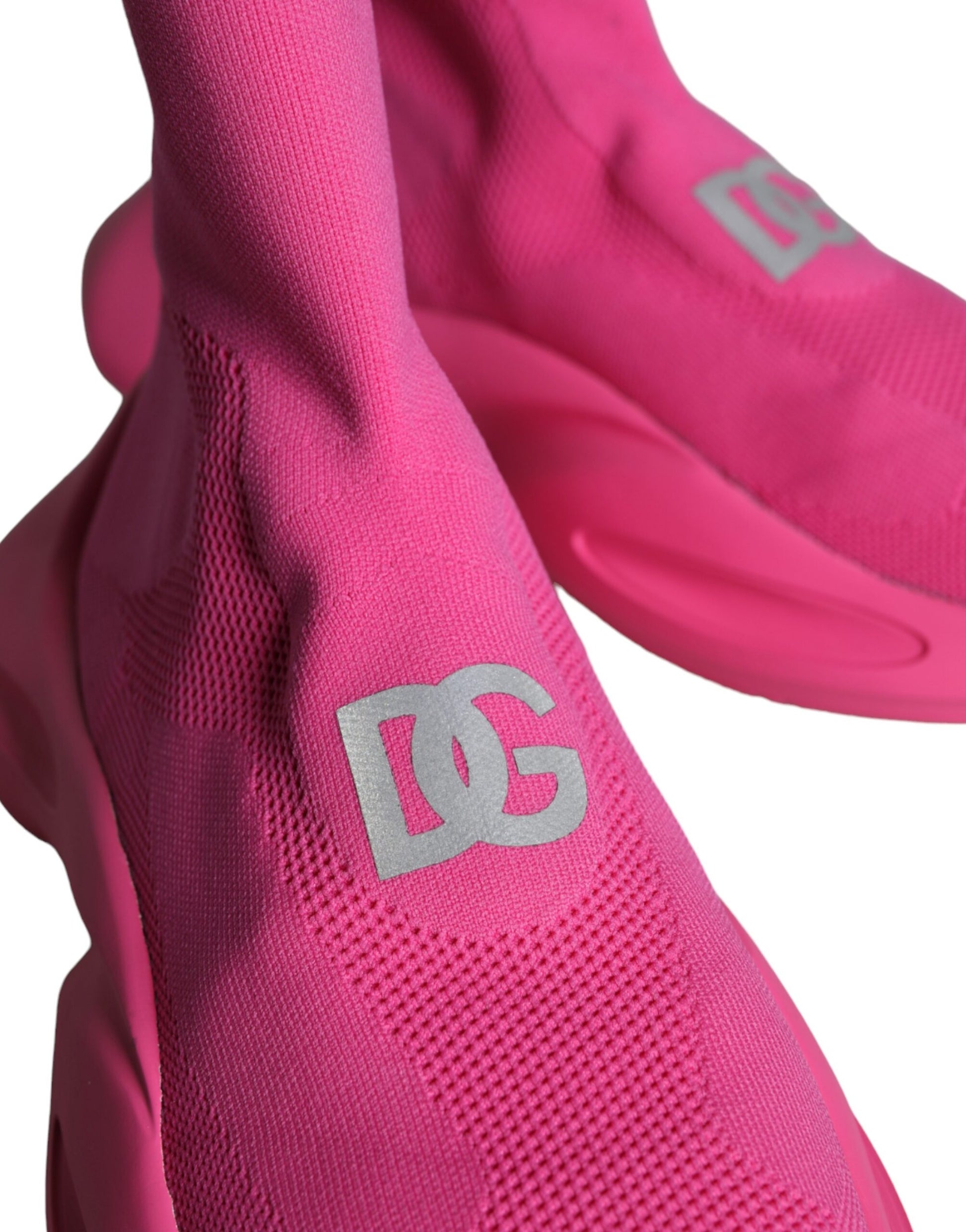 Pair of pink sneakers with white logo on side