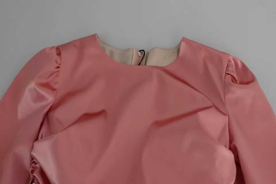 A pink long sleeve bodycon sheath midi dress by Dolce & Gabbana