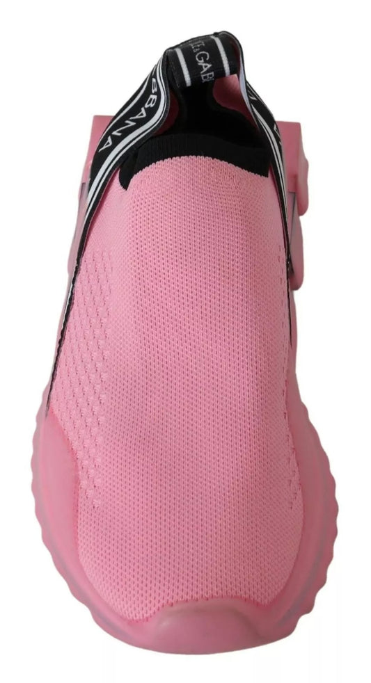 Pink athletic shoe with black laces