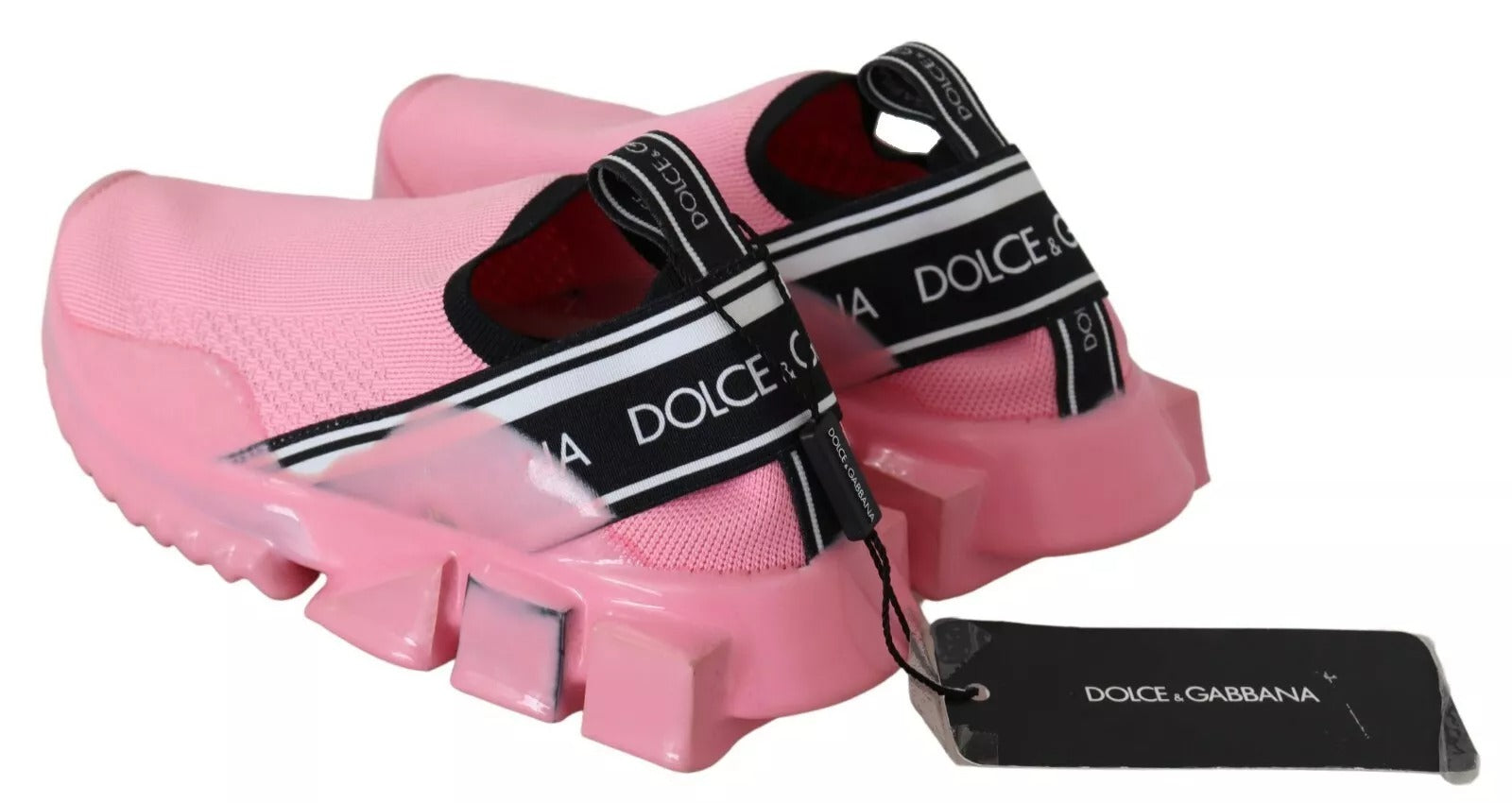 Pink sneakers with black stripes on sides