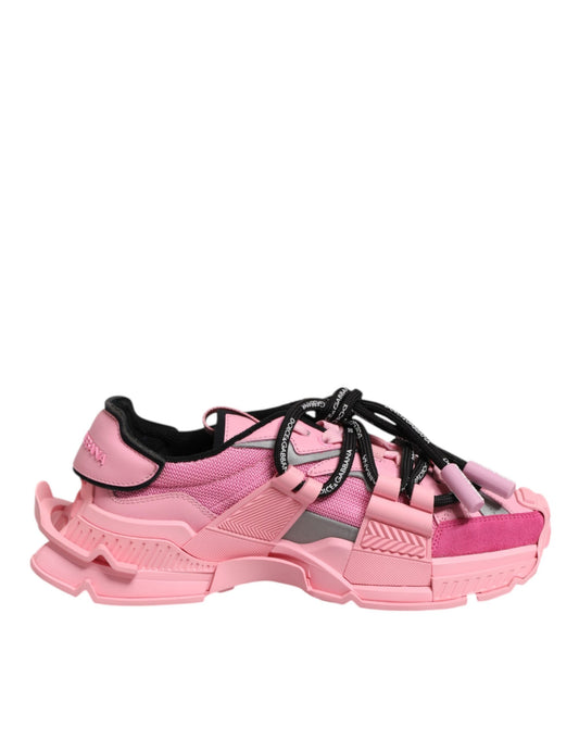 Pink women's sneakers with laces, featuring a low top and chunky sole