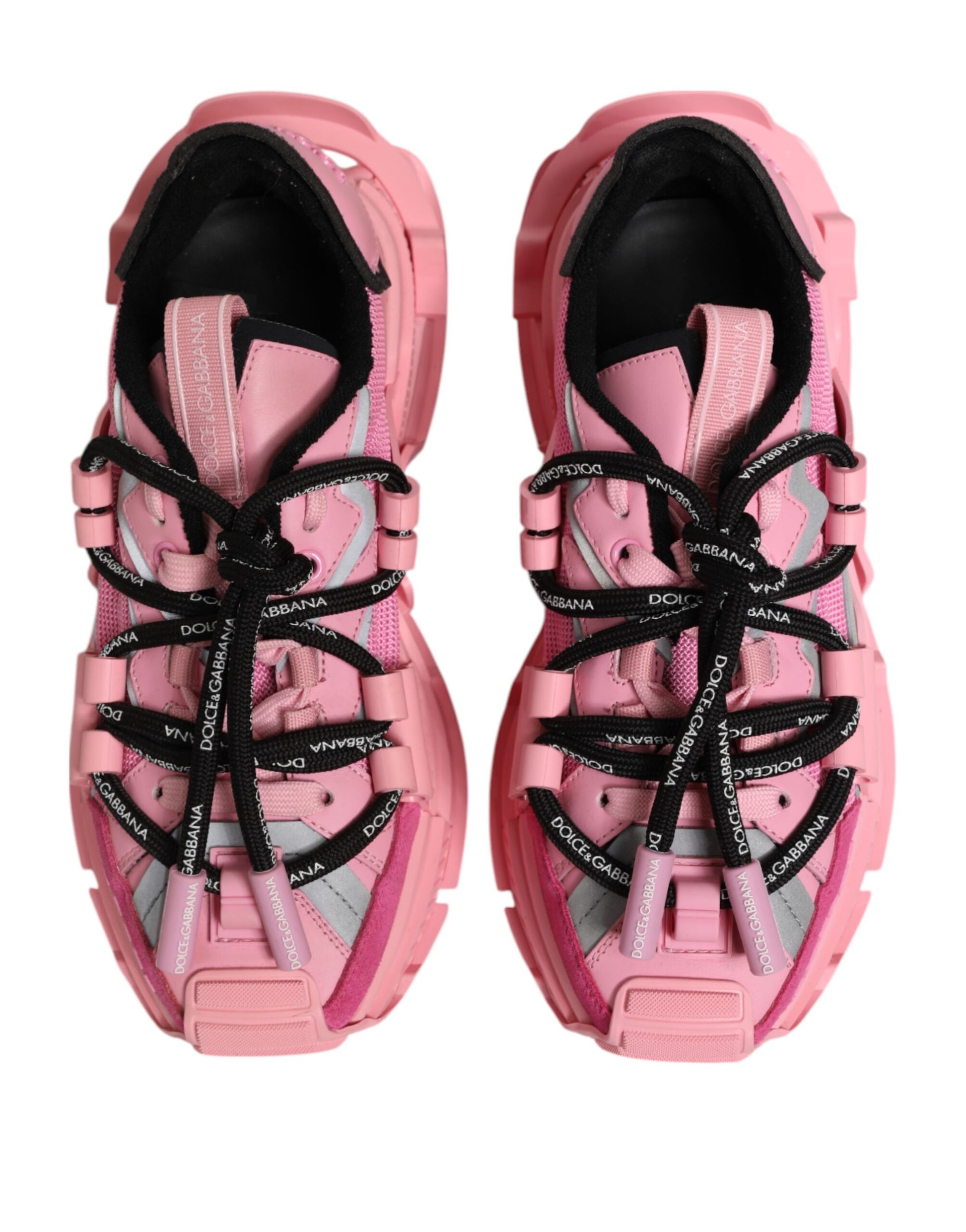 Pair of pink women's sneakers with laces and a logo on the side
