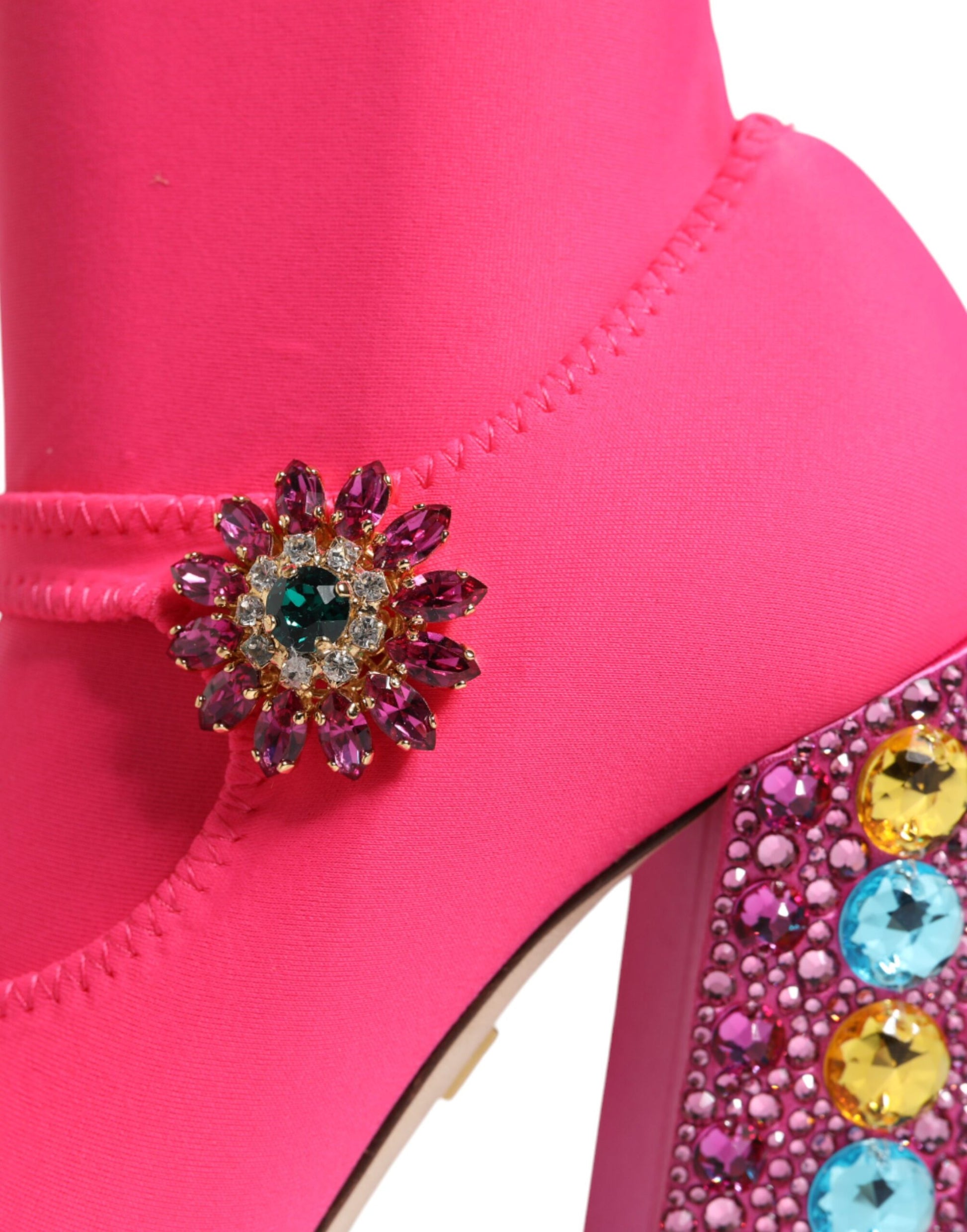 Pink high heel shoe with rhinestone embellishment on toe