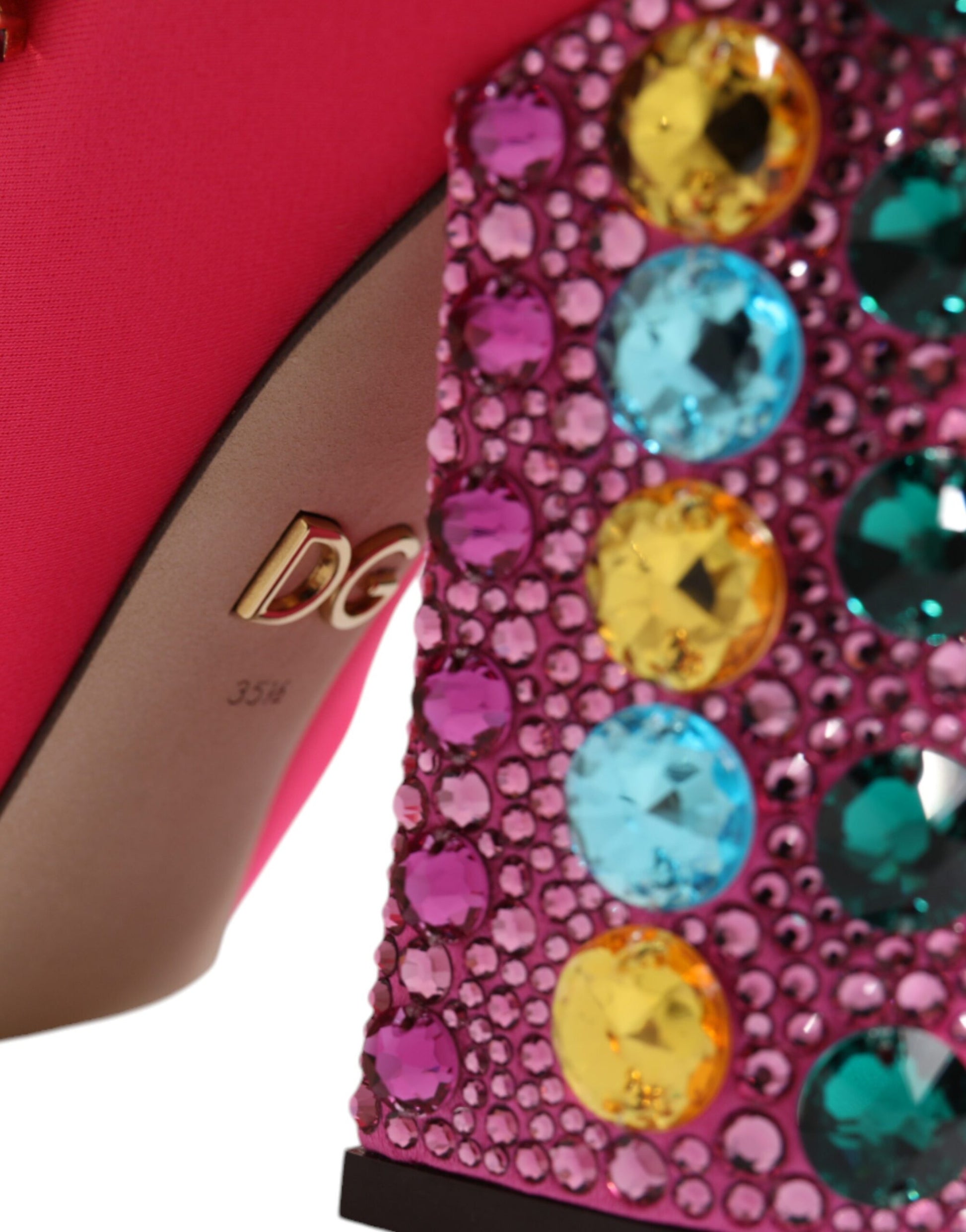 Red high heel shoe with rhinestones on toe cap