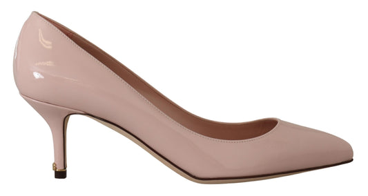 Pair of women's pink high heel shoes with pointed toe and stiletto heels