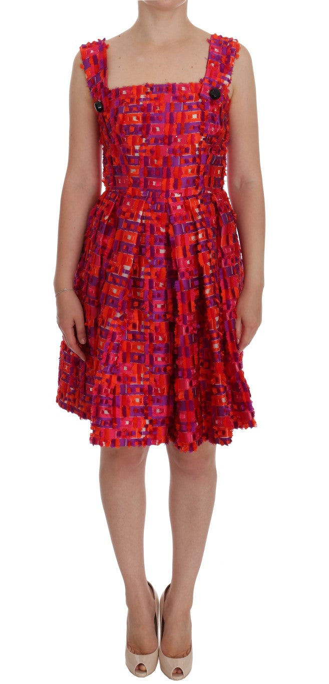 Woman wearing red dress with short sleeves and ruffled hem