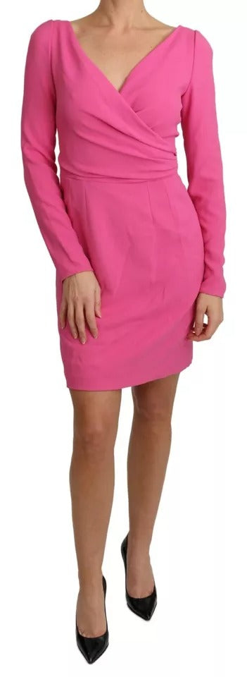 A pink bodycon dress with a plunging neckline and short sleeves