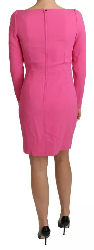 A pink bodycon sheath dress with plunging neckline, made of rayon