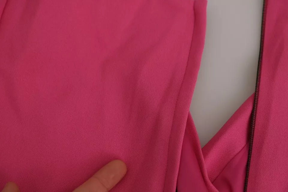 A pink plunging bodycon sheath mini rayon dress with a zipper in the front