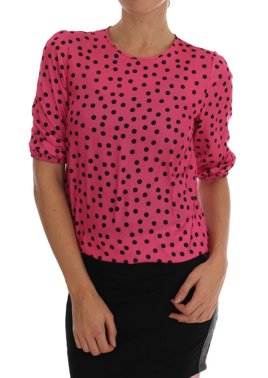 Pink polka dot shirt on woman