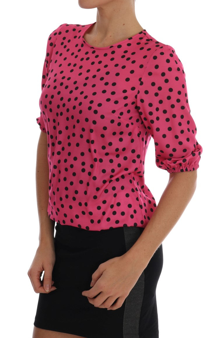 Pink polka dot blouse with black skirt